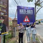 Jasa Raharja Cabang Gorontalo bersama Kepolisian Pasang Spanduk Hi-Vis Imbauan Keselamatan di Kec. Sipatana Kota Gorontalo